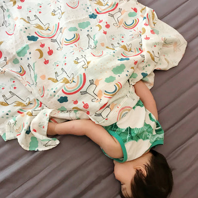 Baby holding blanket towel