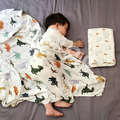 Baby holding blanket towel